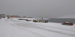 Hunting equipment including boats, all-terrain vehicles, snowmobiles and sleds along the shoreline in Ulukhaktok, October 2019.