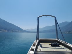 Sampling in front of the mountain panorama of Lake Zug.